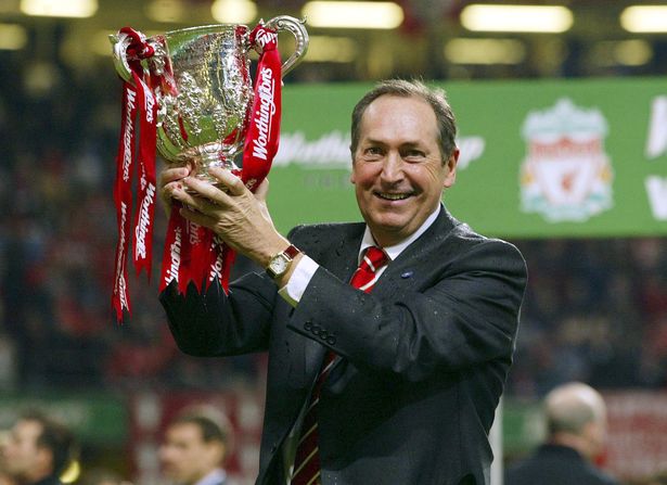 Houllier holding the Worthington Cup after Liverpool's success in 2003