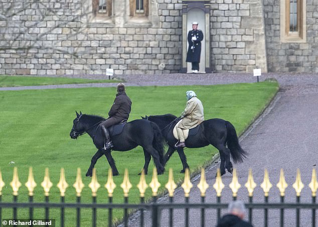 Her Majesty, 94, sported a silk headscarf and beige trench coat for a leisurely ride around her home accompanied by an aide