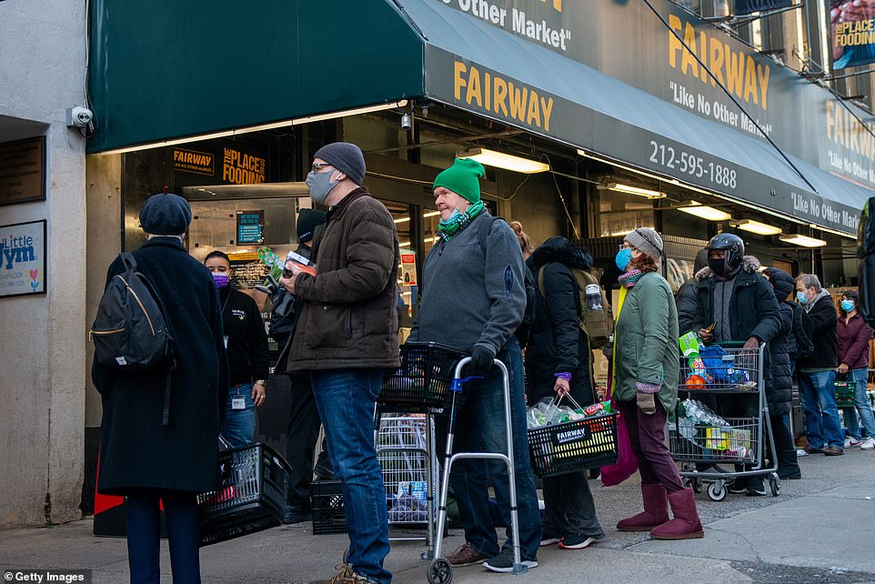Stocking up! People pictured waiting in long checkout lines outside Fairway Market on the Upper West Side in anticipation of the nor'easter on Tuesday