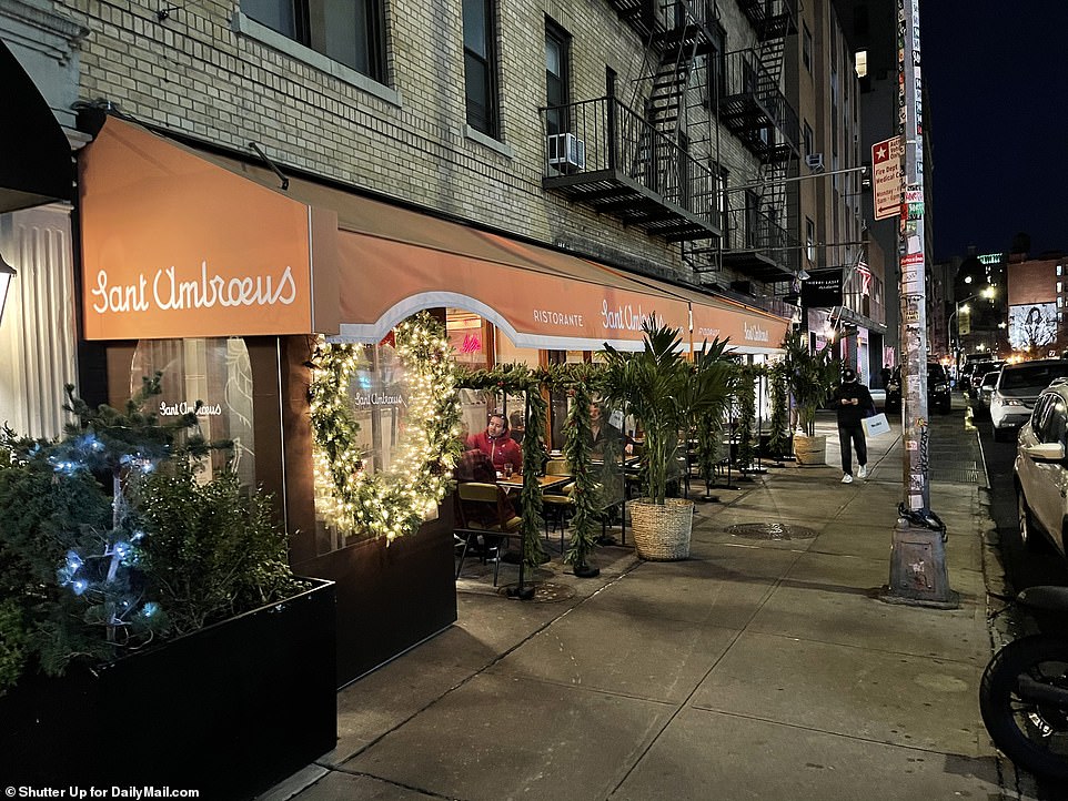 In the holiday spirit: Diners enjoyed the festive decorations at Sant Umbroeus in Manhattan before outdoor dining will be shut down on Wednesday afternoon