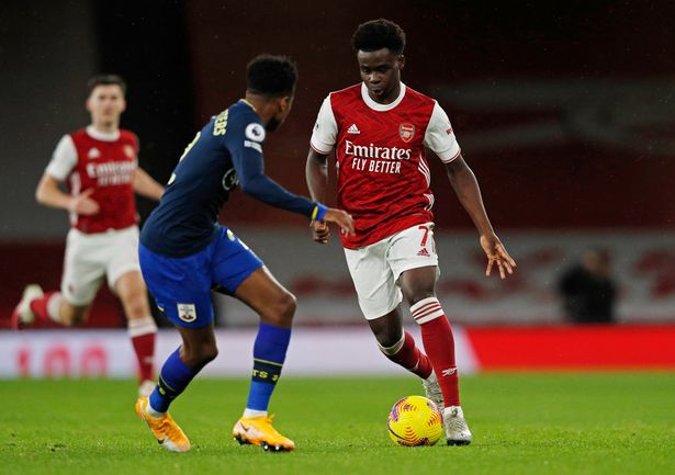 Arsenal's Bukayo Saka takes on Southampton's Kyle Walker-Peters