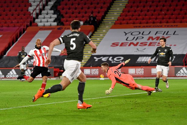 Dean Henderson watches on as David McGoldrick bags an early opener