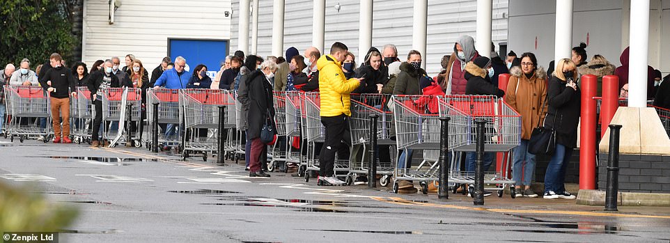 Huge queues were seen outside Costco in Manchester as shoppers rushed to stock up on their Christmas dinner essentials