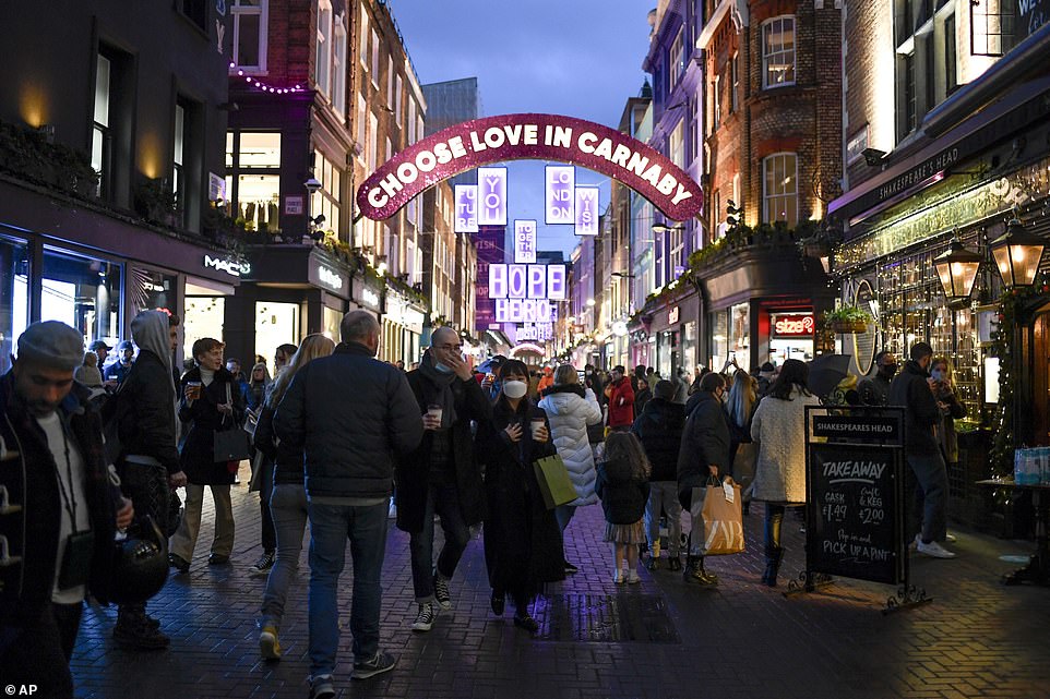 Shoppers took to Carnaby Street in London last night to enjoy the last evening  of non-essential stores being open before Tier 4
