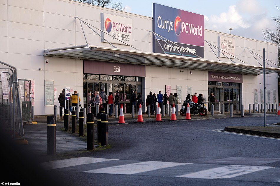The big rush to the highstreet on the last Saturday before Christmas (queues outside Currys PC World, pictured) was a stark contrast to scenes yesterday which saw highstreets nearly deserted on what many hoped would be a Frenzied Friday shopping spree