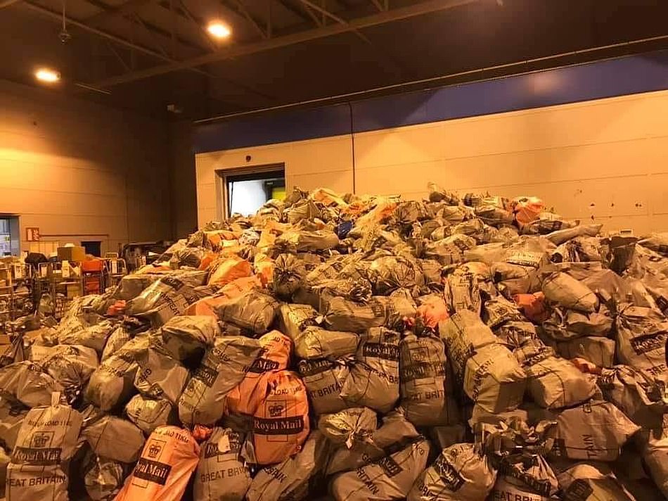 The highstreet figures come as images of a mountains of post bags at sorting offices spark fears about delayed Christmas presents this season. A Bristol sorting office, pictured