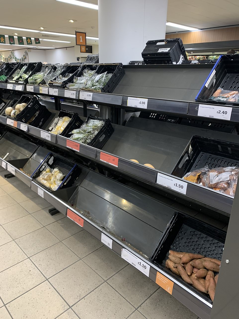 The shelves at this Sainsbury's store were looking stark this morning as long lines of shoppers began queuing at supermarkets across the UK early this morning