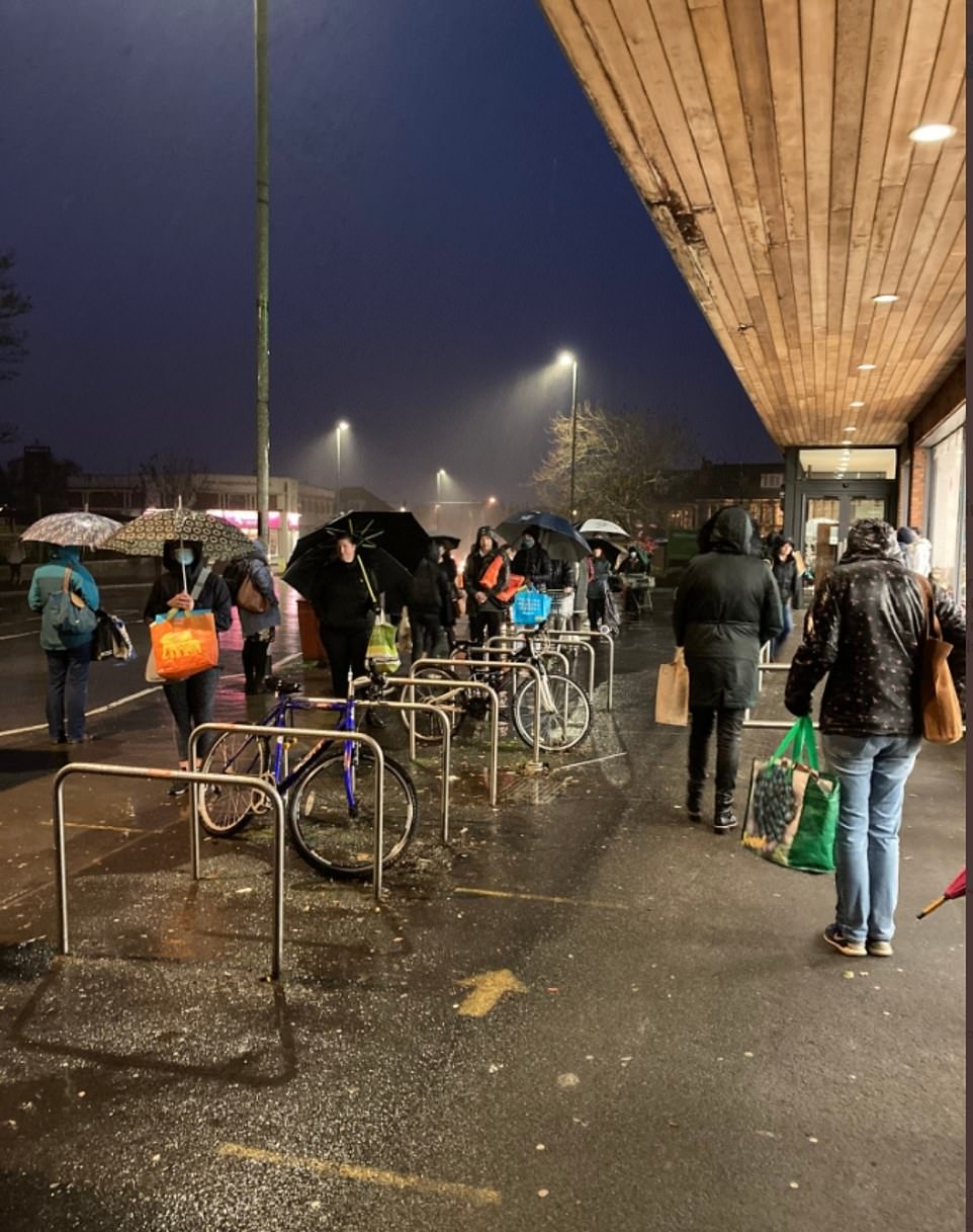People braved the rain to wait in line and do their shopping earlier than normal before Christmas Day at the Henleaze Waitrose store