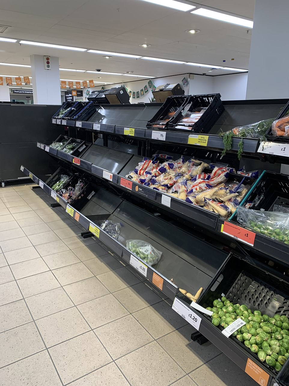 There were empty spaces in the vegetable aisle at this Sainsbury's store amid fears the French travel ban could limit food supply chains