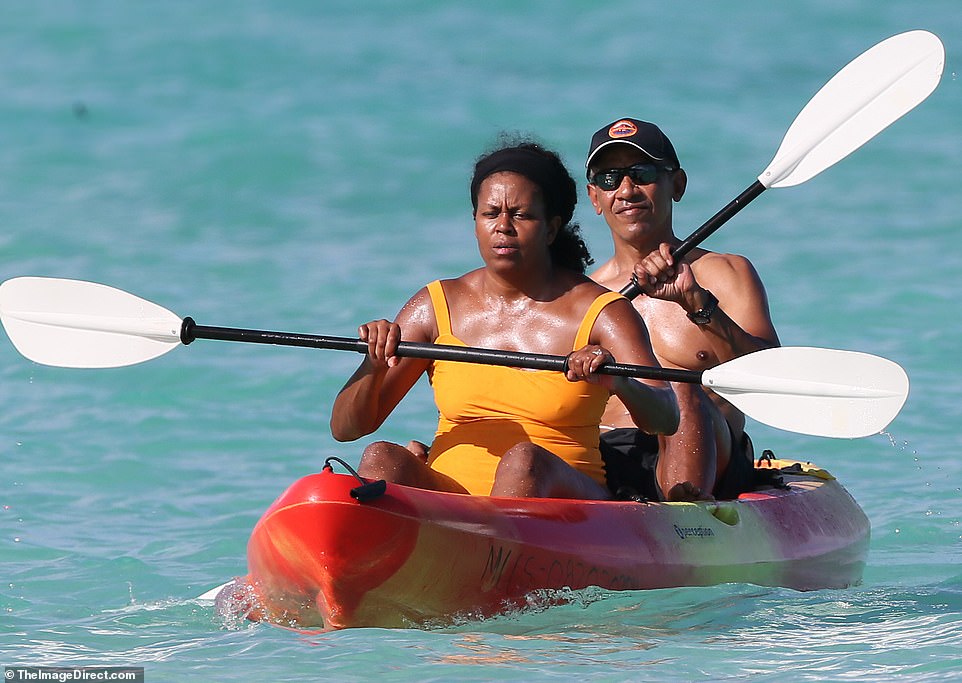 Michelle went make-up free and wore her hair tied off her face. Barack wore a baseball hat and some sunglasses