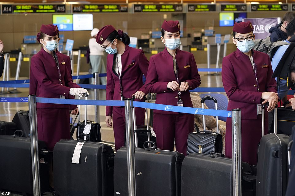 Flight attendants wait to check in luggage at Los Angeles International Airport on Wednesday
