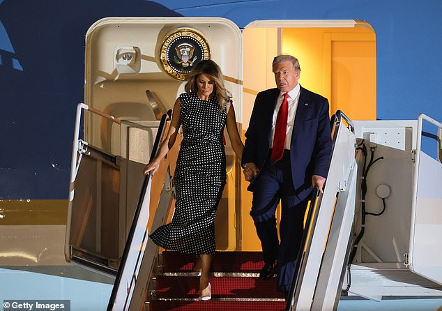 The Trumps exit from Air Force One at the Palm Beach International Airport on Wednesday. Melania Trump on Wednesday ditched her thigh high boots and changed into shoes and a dress for her arrival in Florida