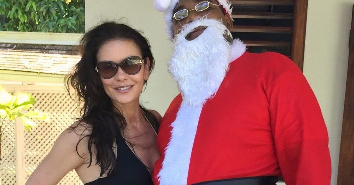 Catherine Zeta-Jones poses in skimpy bikini with Santa Claus in festive snap