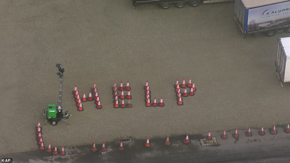 Drivers still stranded in Dover spelt out 'help' using traffic cones after days of waiting in Kent