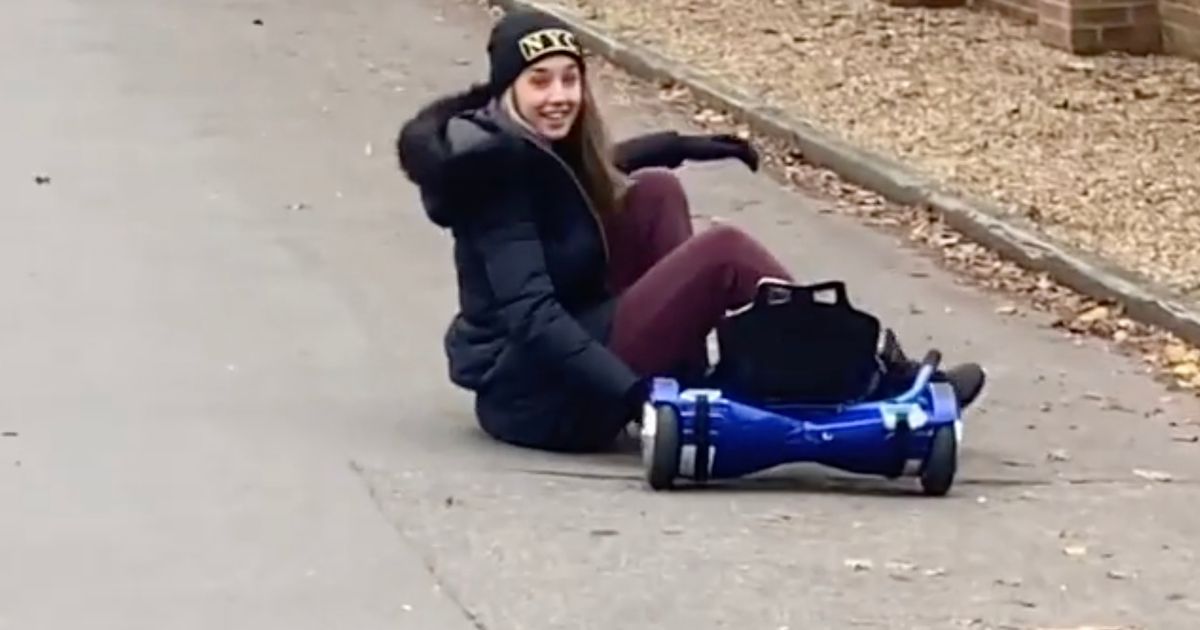 Emily Andre takes a tumble on a hover board as Pete films the whole thing