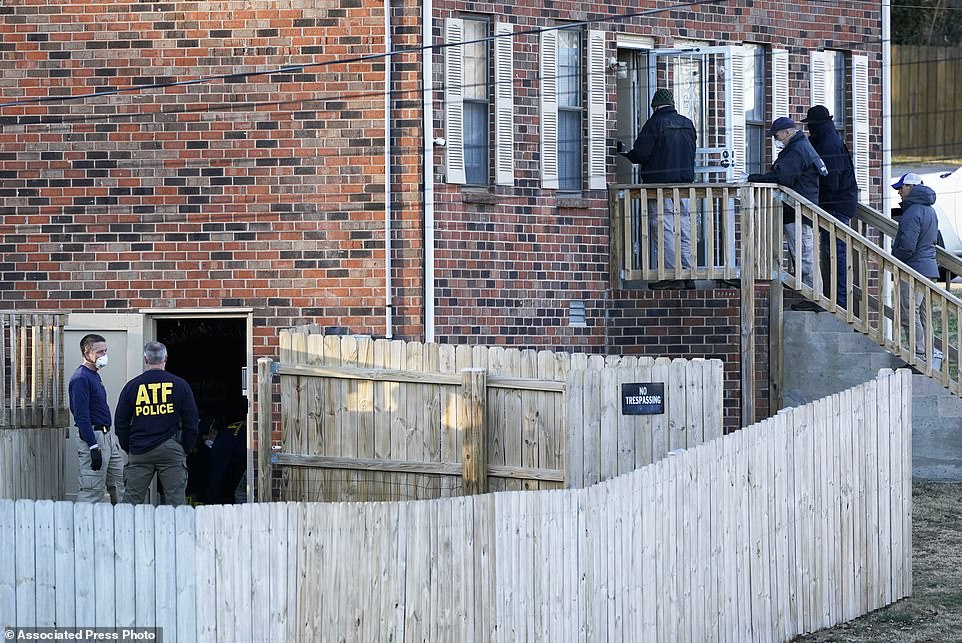 FBI and ATF agents investigate Warner's home on Saturday. 'No one else is presently believed to have been involved,' the Metro Nashville Police Department said in a statement naming Warner as the prime suspect