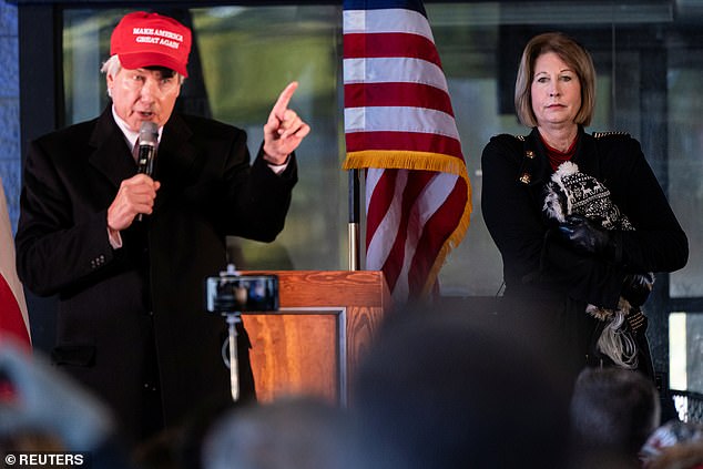 Wood, who has represented Kenosha shooter Kyle Rittenhouse, has continued to spread baseless claims of election fraud to his followers since Trump's loss in November. He has wrongly suggested that Dominion Voting Systems were rigged. He is pictured with Sidney Powell during a press conference on election results in Alpharetta, Georgia on December 2