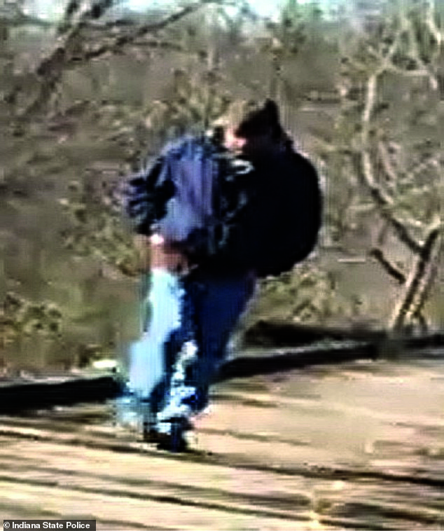 This man in blue jeans and a blue jacket is believed to be a suspect in the girls' murders
