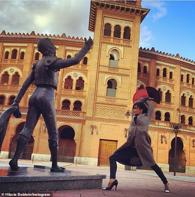 In 2014 Hilaria posted this photo with a flamenco fan and posing in front of a torrero statue with the caption: 'Hoping one day we all just dance with the bulls'