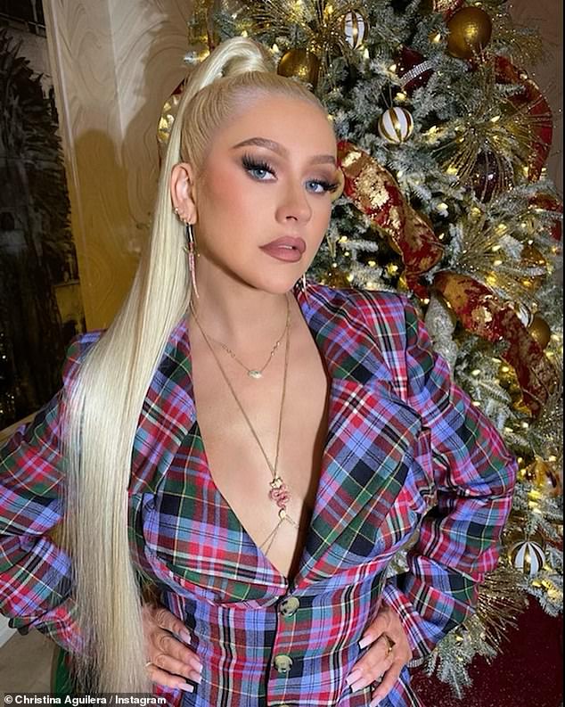Bye bad year: Christina Aguilera, 40, said, '2020 has been too much for everybody. 'Let's part with it, let's make our peace and move on ... I'm very excited to shed old skins, depart from old ways'