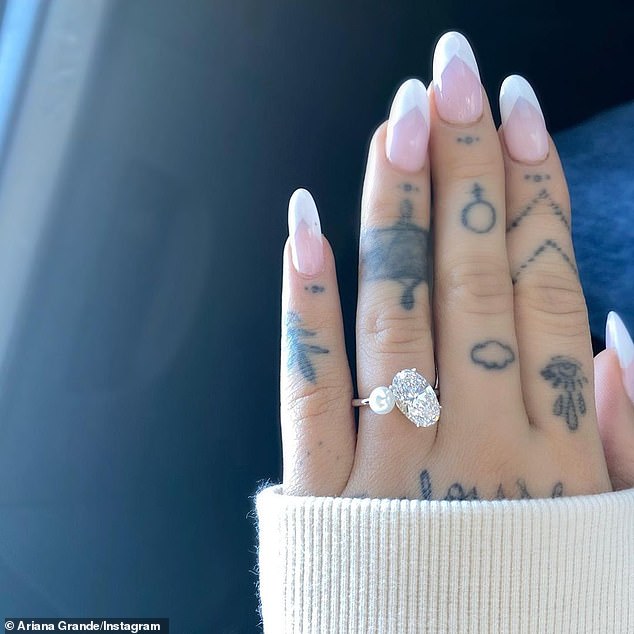 Ariana Grande announced she’s ENGAGED to Dalton Gomez as she shows off stunning sparkler