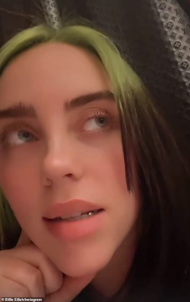 Billie Eilish jokes with her fans to stop making fun of her electric green mullet