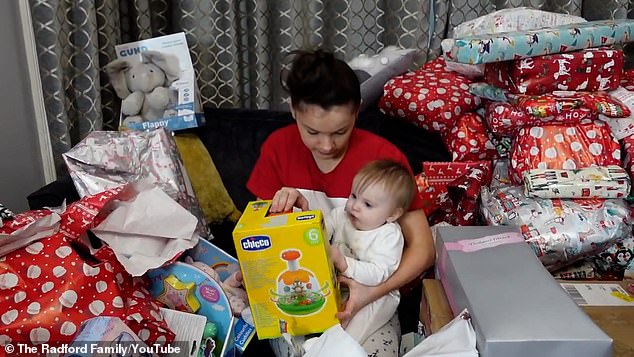 Britain's biggest family The Radfords - with 22 kids - unwrapped presents together in footage from Christmas Day