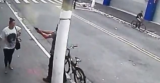Harrowing moment woman, 34, is shot dead in the middle of a street in Brazil