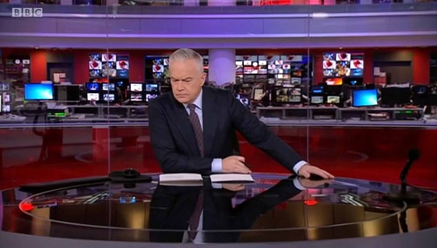 Huw dare you! BBC newsreader Huw Edwards shocks fans by NOT striking his signature hand-on-desk pose