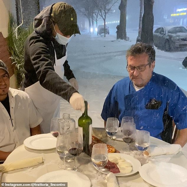 NYC restaurant owner mocks Gov. Cuomo’s ban on indoor dining by hosting dinner for staff in the SNOW