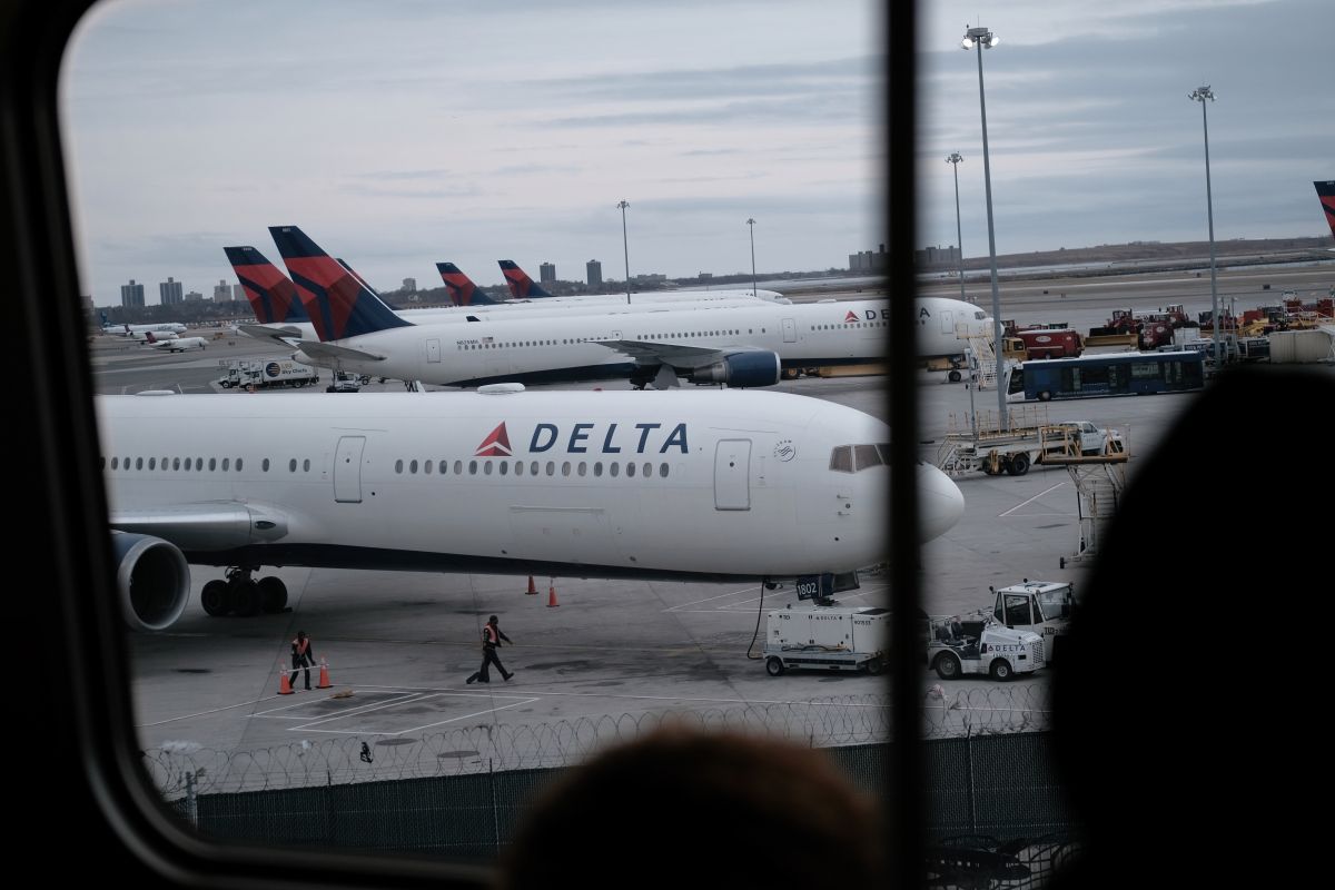Passengers opened the door of a Delta plane that was going to take off from New York