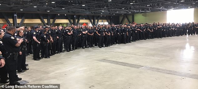 Pictures show hundreds of maskless cops gathered together for photo at ‘superspreader’ event