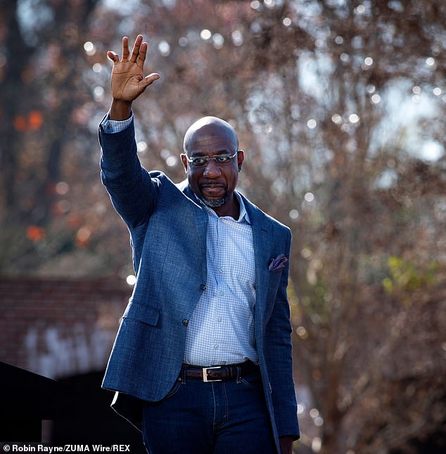 Reverend Raphael Warnock (pictured above at a campaign event in Columbus, Georgia, on Monday) has refused to comment on a police bodycam video in which his then-wife accused him of running over her foot during a domestic dispute in March