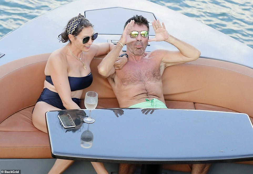 Simon Cowell, 61, looks carefree as he enjoys jet ski ride in Barbados after breaking his back