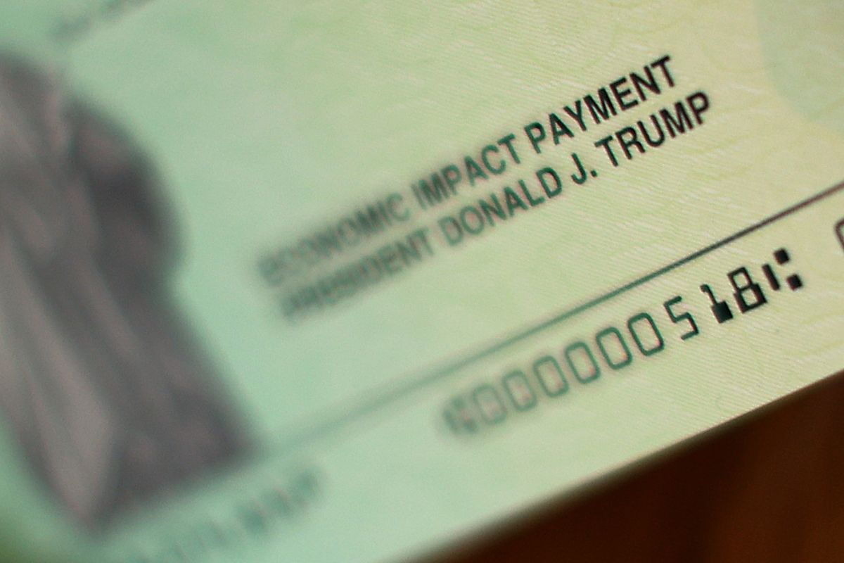 Why might 14 million taxpayers experience a delay in the delivery of their stimulus check by the IRS?