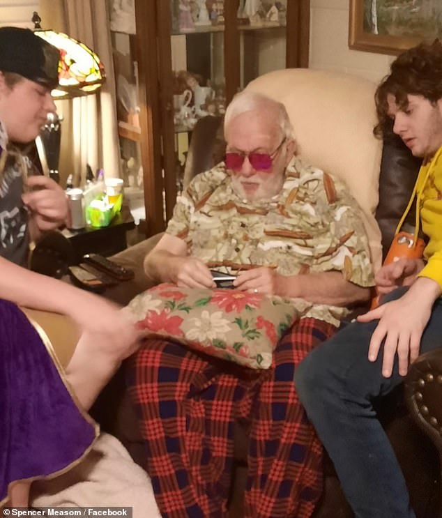 His family (pictured with him) also cannot believe their eyes. The 80-year-old's son wrote on Facebook that the glasses were a Christmas present from the grandchildren