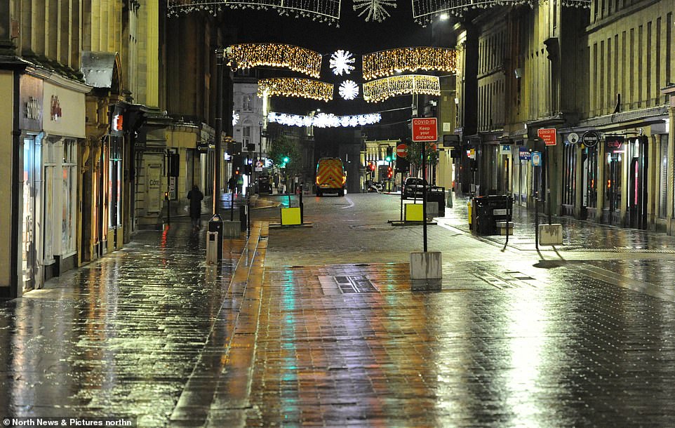 NEWCASTLE: A lone person walks down an abandoned street in the heart of Newcastle city centre, which is being patrolled by police to ensure people don't break lockdown rules