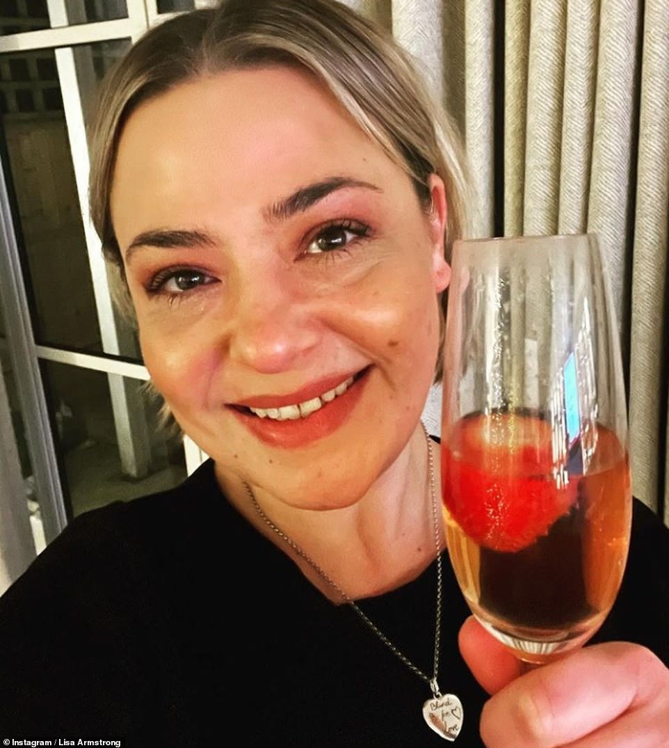 Toasting it in! Lisa Armstrong beamed a smile as she raised a glass to 2021