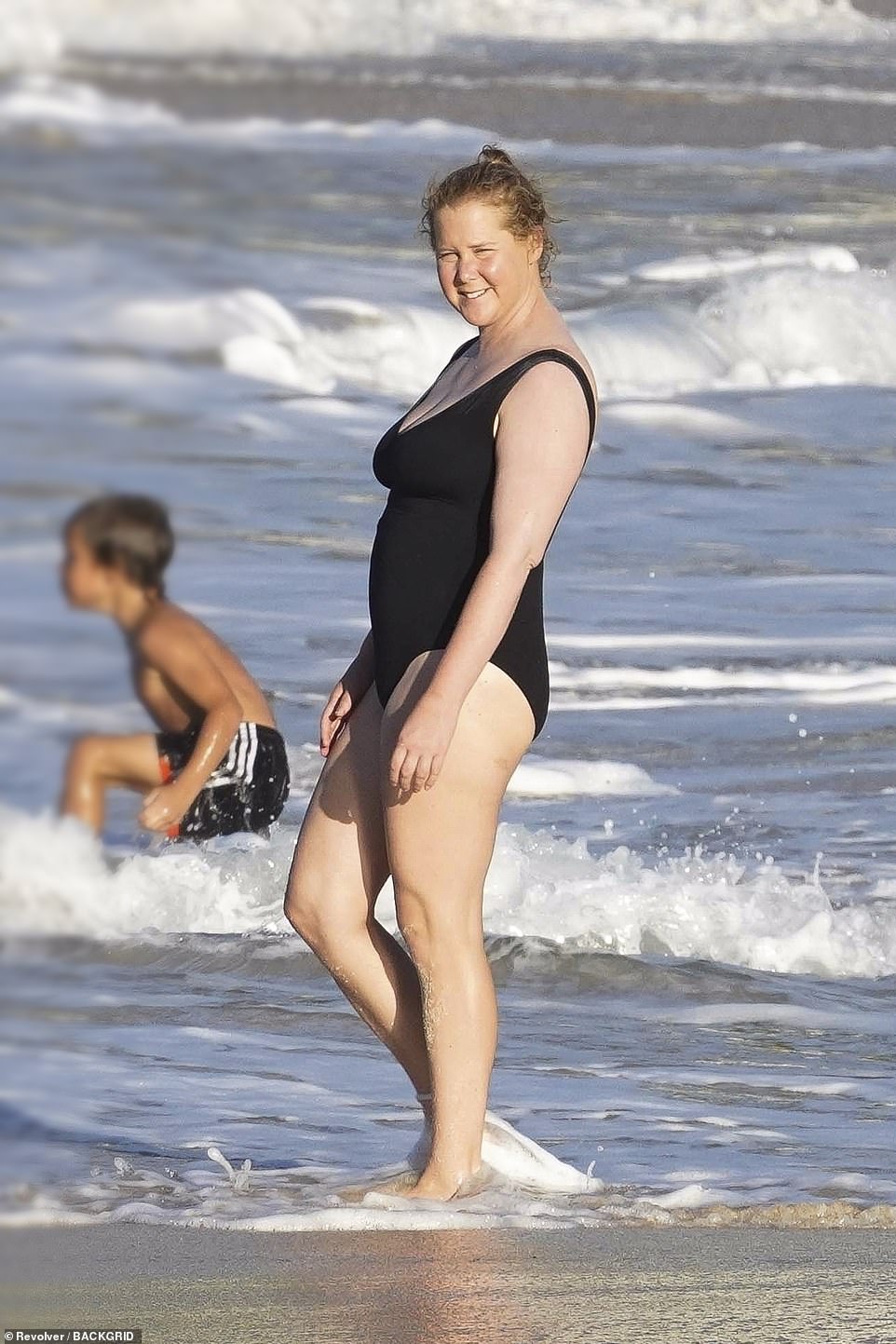 American actress Amy Schumer (pictured), 39, her husband Chris Fischer, 40, and their son Gene, one, were seen taking a dip in the sea on Wednesday