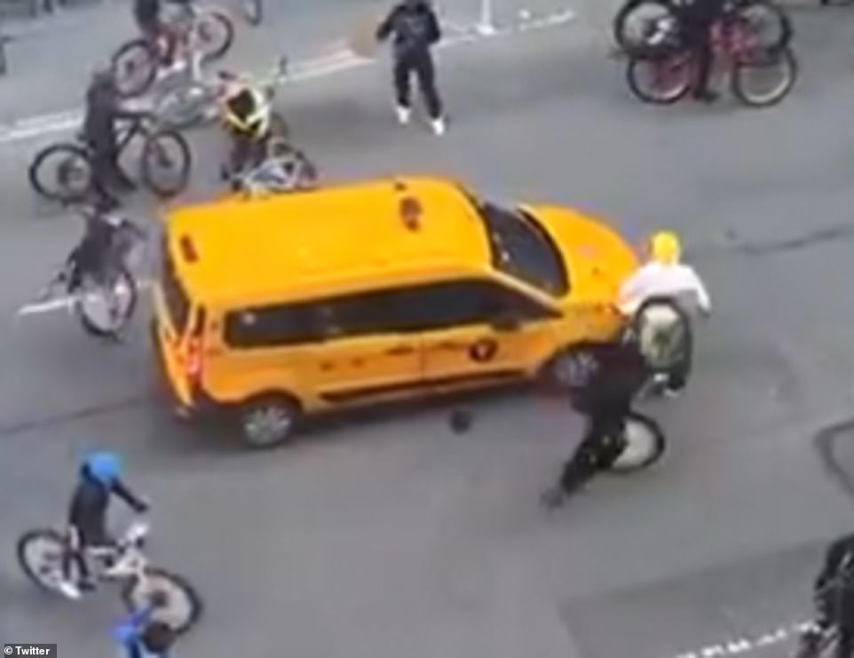 At one point, one of the boys was seen hitting the man on his back with his bike
