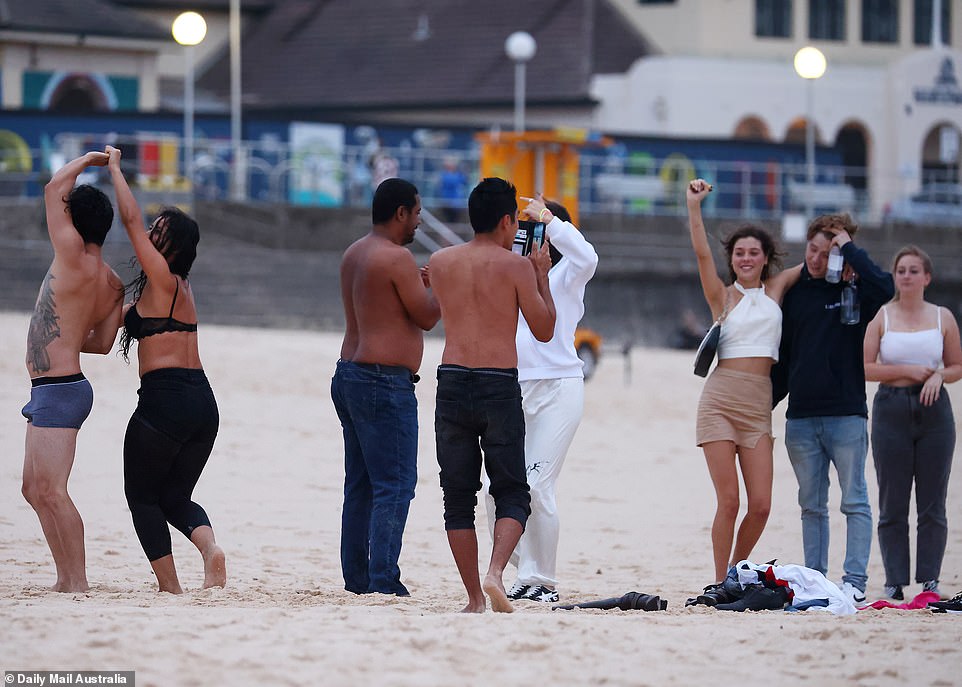 The New Year's celebrations continued for groups of revellers who descended on Sydney's most iconic beach on Friday morning