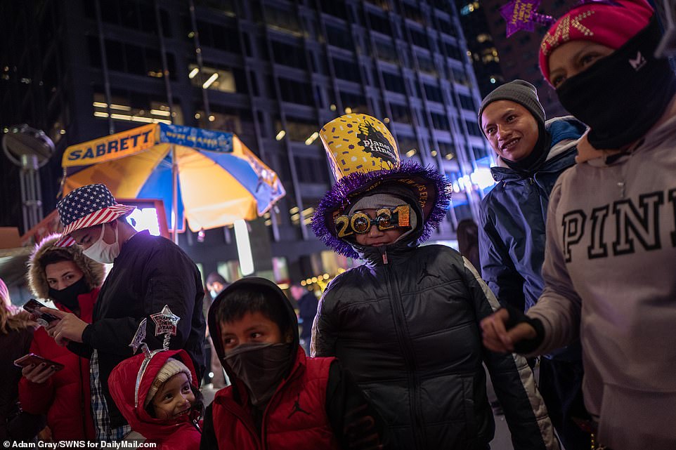 Several people were seen wearing decorative 2021 hats near the Times Square area Thursday night