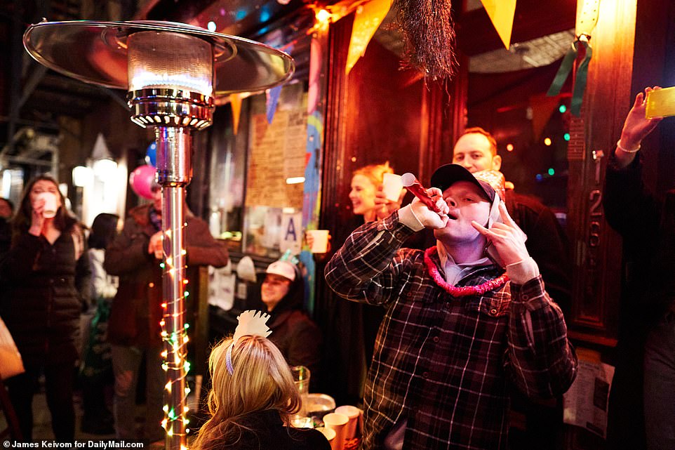 People celebrated at the East Village Social restaurant earlier on Thursday before establishments closed at 10pm