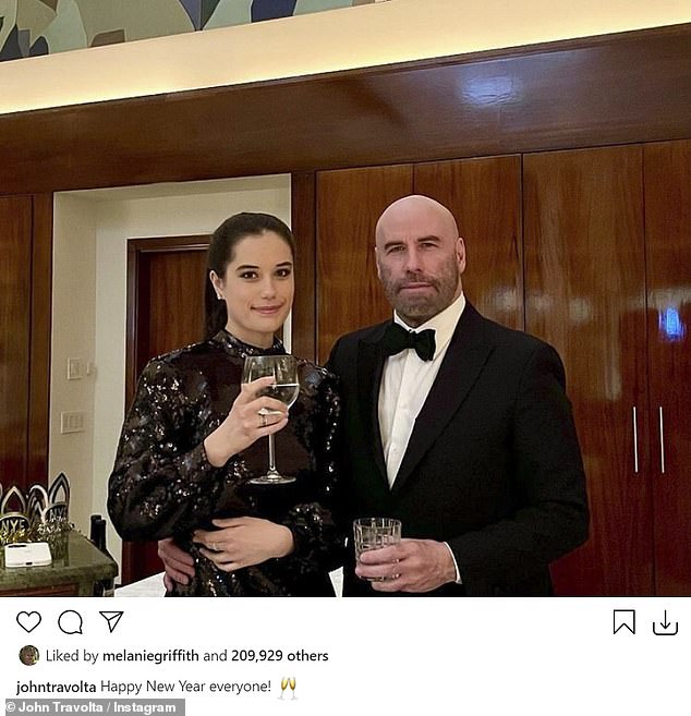 Staying strong: John Travolta, 66, posed in black tie with his 20-year-old daughter Ella and the two raised a glass to wish everyone a Happy New Year. He lost his wife Kelly Preston to cancer in 2020
