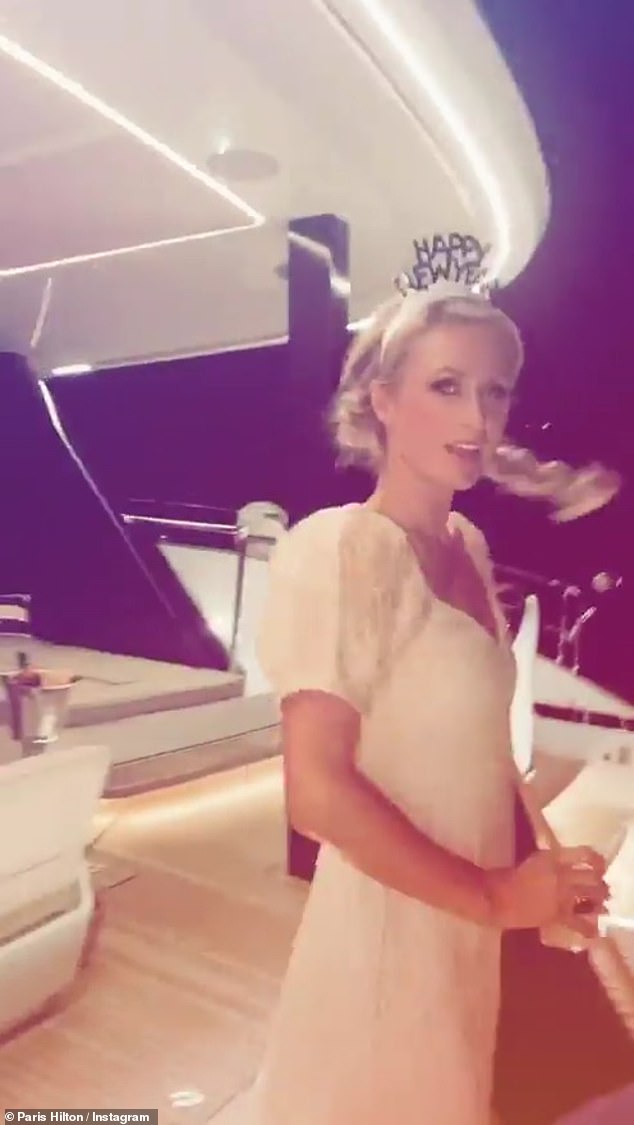 Party time: Paris later updated her Instagram to show herself dressed up to celebrate the arrival of New year's Eve on board the yacht