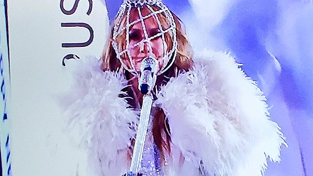 Jennifer Lopez Stuns In 20 Ft. Feather Coat & Diamond Mask For New Year’s Eve 2021 Performance