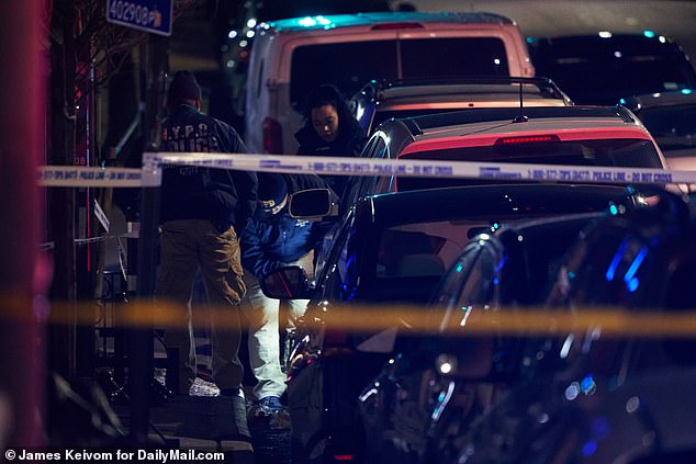 Investigators on the scene of the early morning shooting in Queens which marked the Big Apple's first murder of 2021