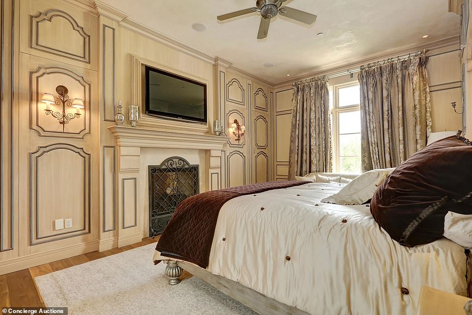 One of the home's seven lavish bedrooms is pictured . Given that the home is just a short distance from Calgary Airport, it will be the perfect place to host guests