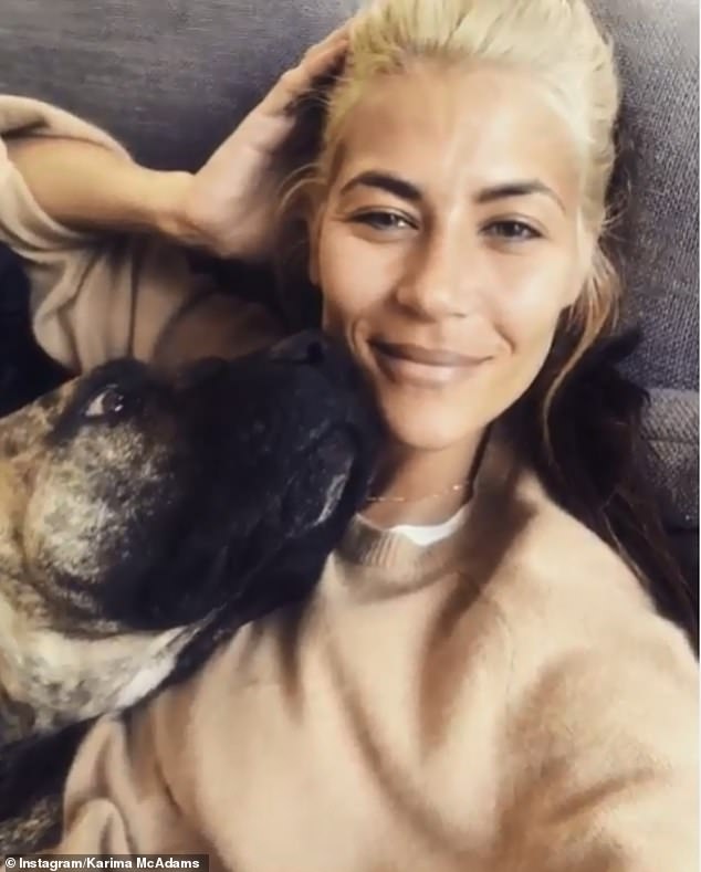 Getting close: Karima even shared a video on Instagram as she lounged on Professor Green's sofa as his dog licked her face, with the caption: 'I think I'm in there'
