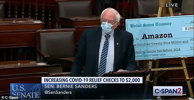Sen. Bernie Sanders, a self-proclaimed democratic socialist, has used props all week to promote the $2,000 checks bill. On Friday he brought large checks with him to the Senate floor to show huge tax rebates that were given to companies like Amazon